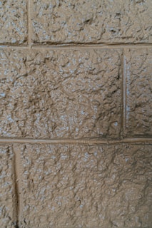 Close-up of textured wall covering with resin finish in neutral colors
