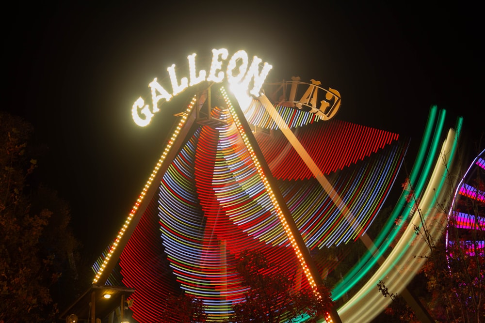a carnival ride at night with colorful lights