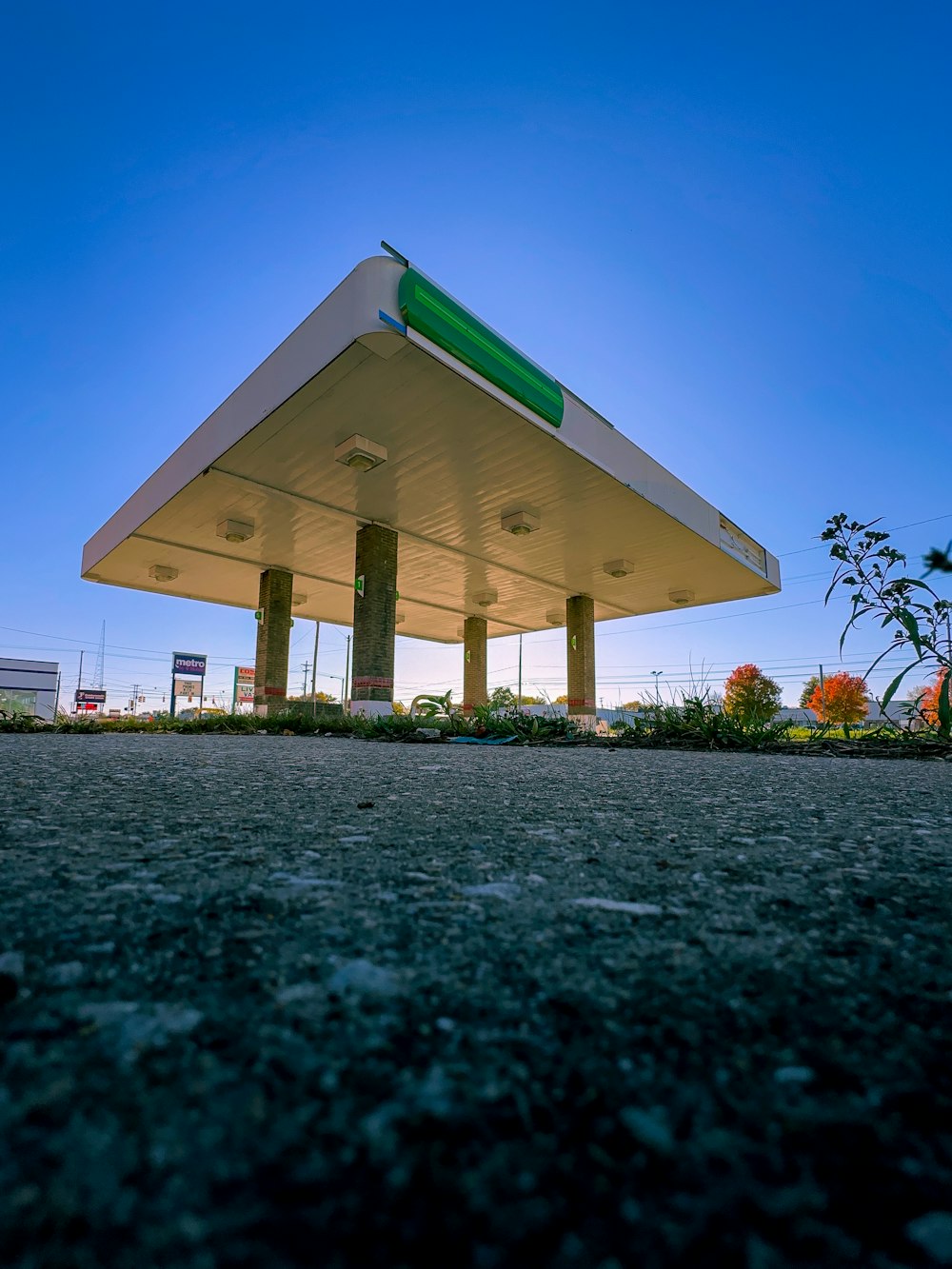 a gas station with a blue sky in the background