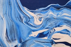 an abstract painting of blue and white colors
