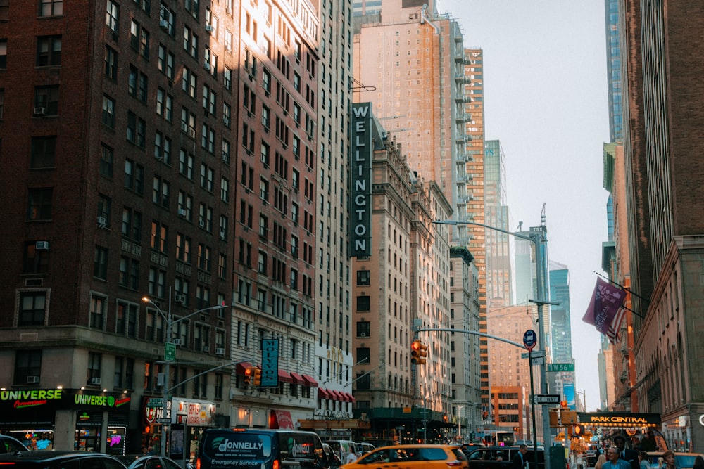 a city street filled with traffic and tall buildings