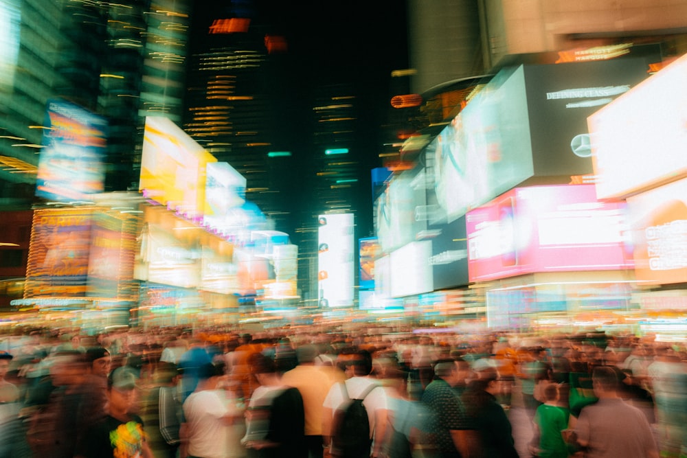 a blurry photo of a crowd of people in times square