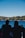 A young couple enjoying breakfast on the hotel terrace overlooking Lake Maggiore.