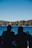 A young couple enjoying breakfast on the hotel terrace overlooking Lake Maggiore.