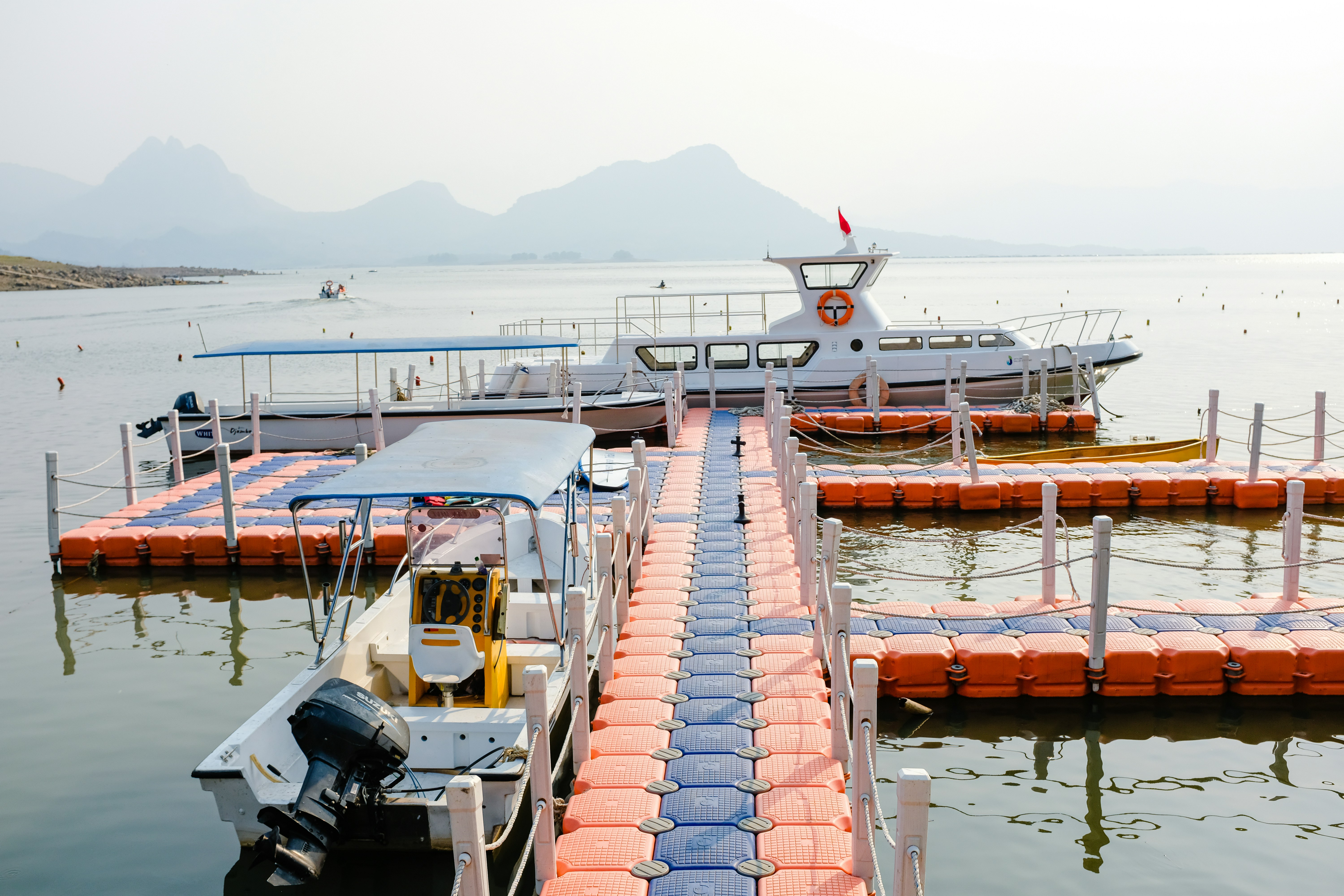 a dock with several boats docked at it