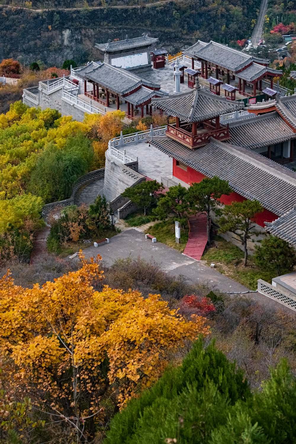 an aerial view of a building surrounded by trees