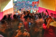 A vibrant festival crowd captured in slow motion, emphasizing energy and excitement.