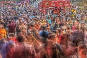 A dynamic action sequence showing multiple camera angles of a chase through a crowded market.