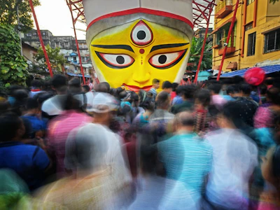 Facial recognition technology scanning faces with saffron, white, and green accents.