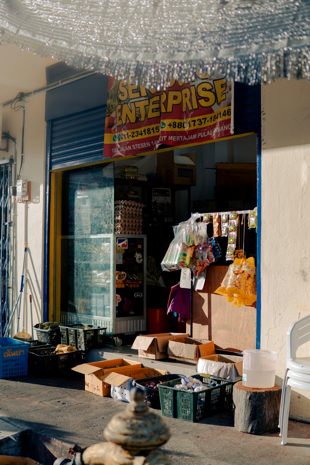 a store front with a lot of items in front of it