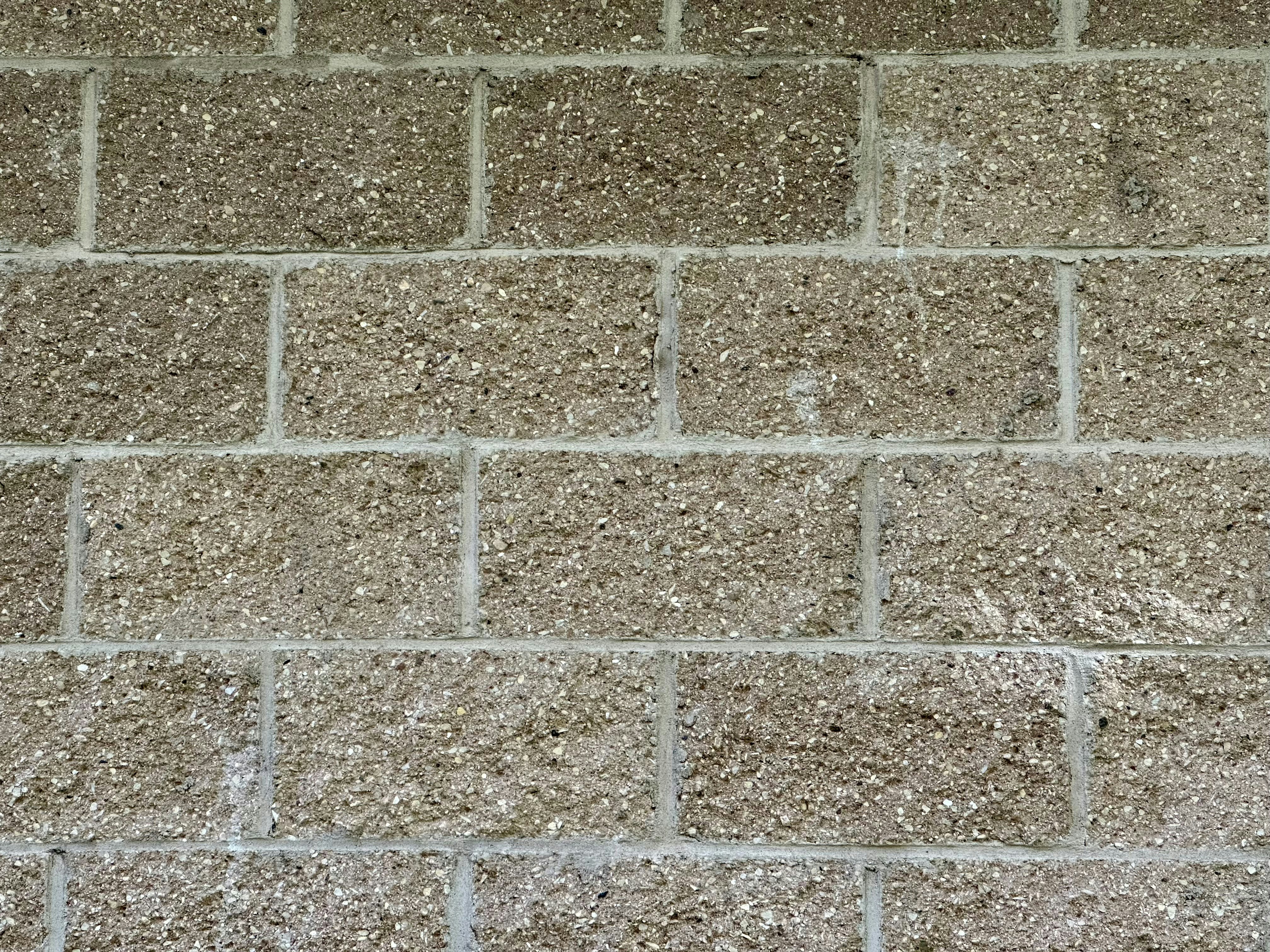 Concrete block masonry wall, residential property, grey blocks