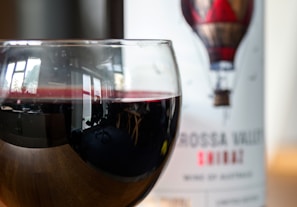 Close-up of a glass of deep red Australian Shiraz catching the light