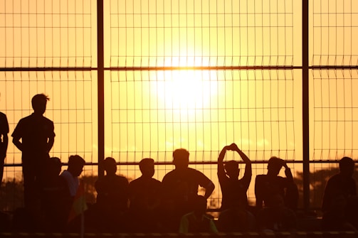 A dramatic sunset silhouette of activists gathered for a cause, featured in a recent film.