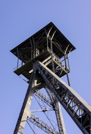 a tall metal structure with a sky background