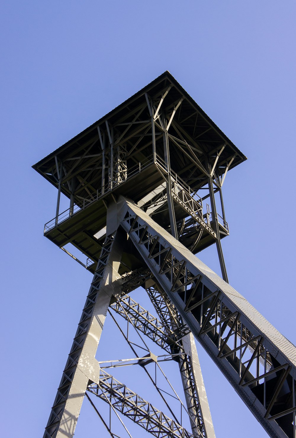 a tall metal structure with a sky background