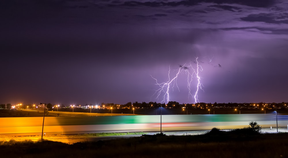 a lightning storm over a city at night