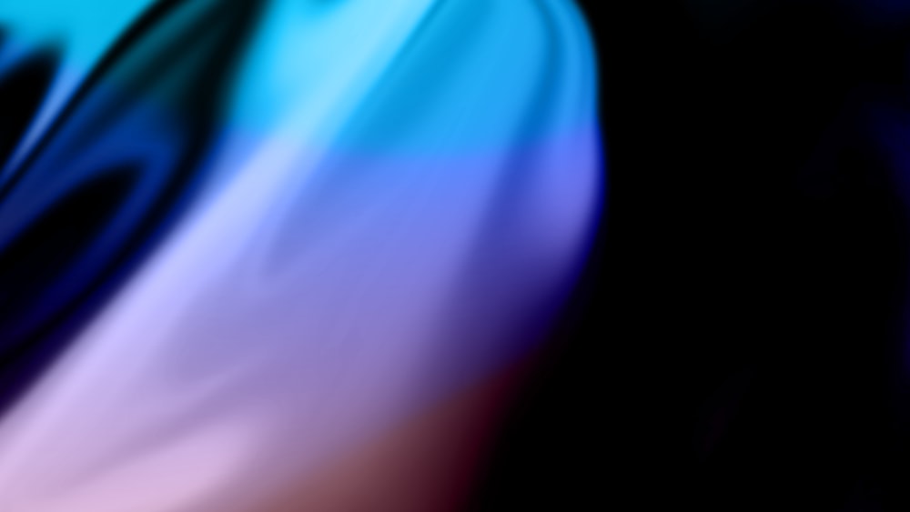 a blurry image of a blue and pink object