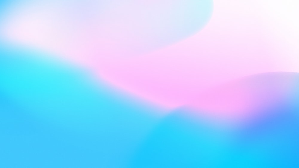 a blurry image of a blue and pink background