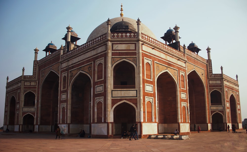 a large brick building with arches and arches