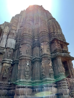 Close-up of intricate temple carvings around Varanasi glowing in soft sunlight