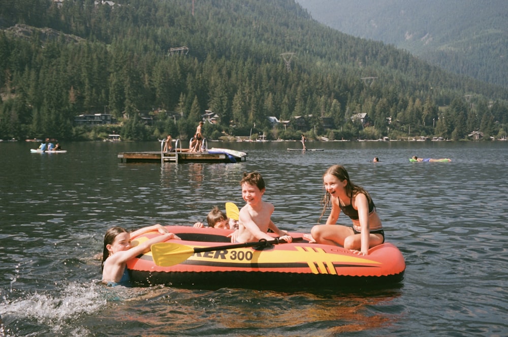 a group of people floating on top of a body of water