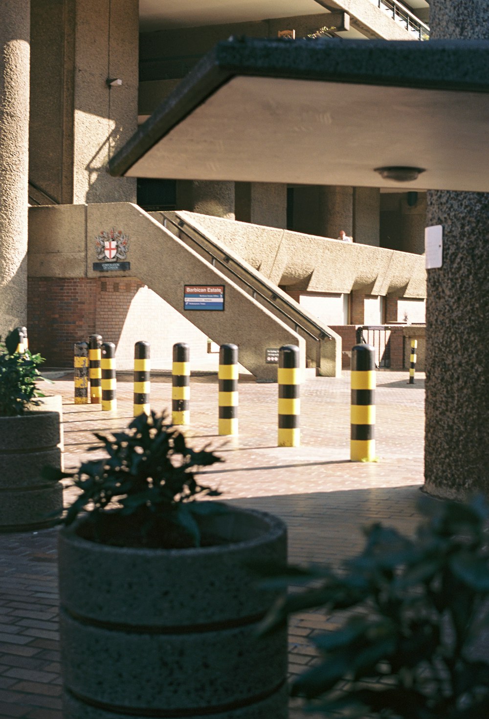 a building with a bunch of yellow and white striped poles