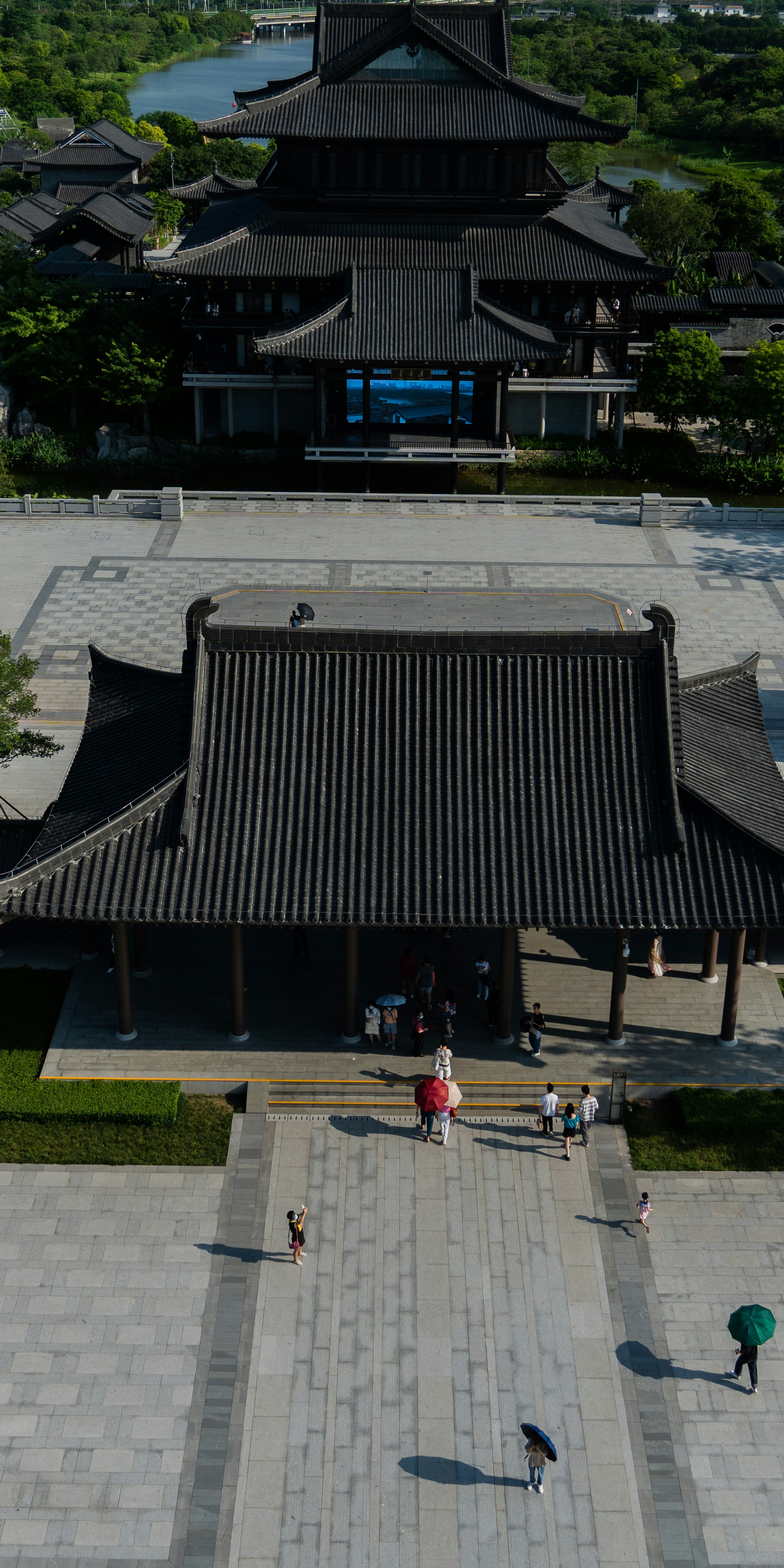 a group of people walking around a building