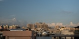 A city skyline with visible fire safety equipment on rooftops.