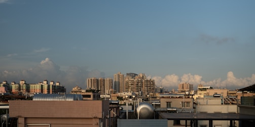 A city skyline with visible fire safety equipment on rooftops.