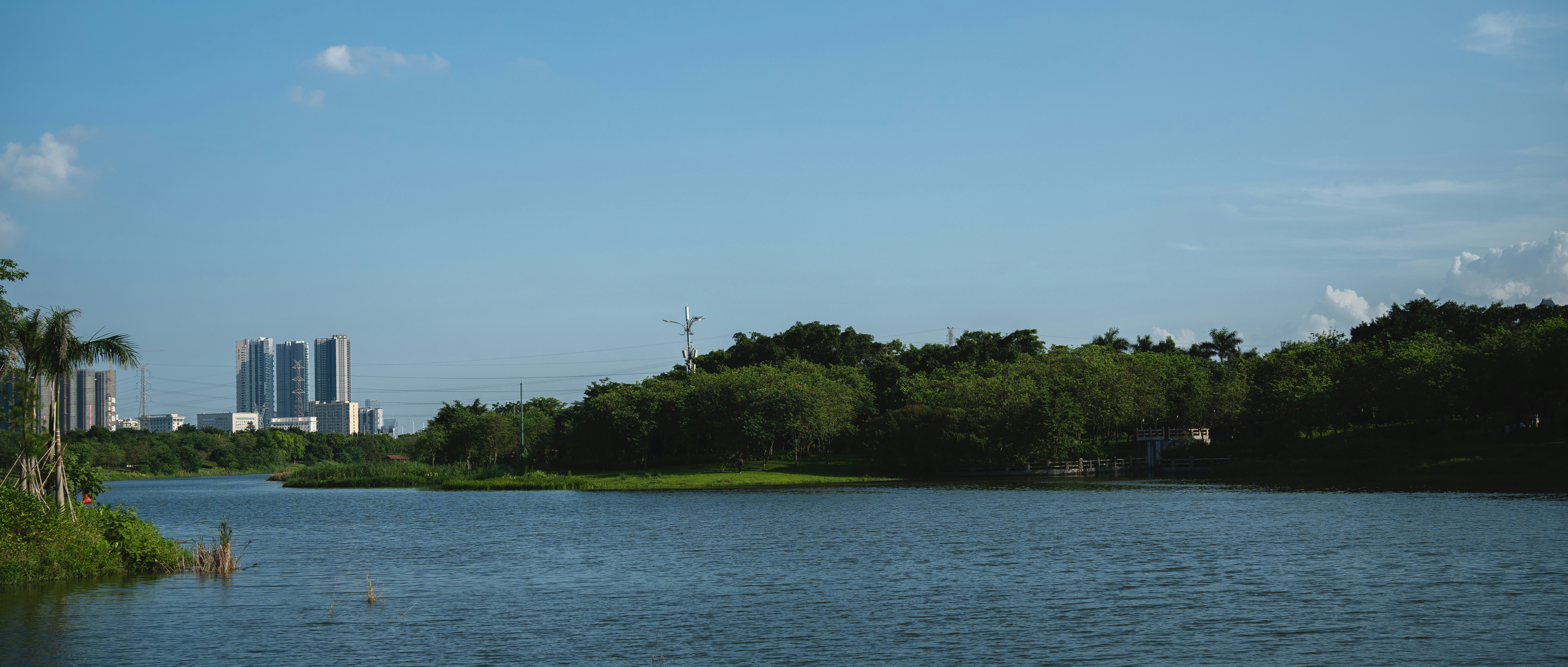 a body of water with a city in the background