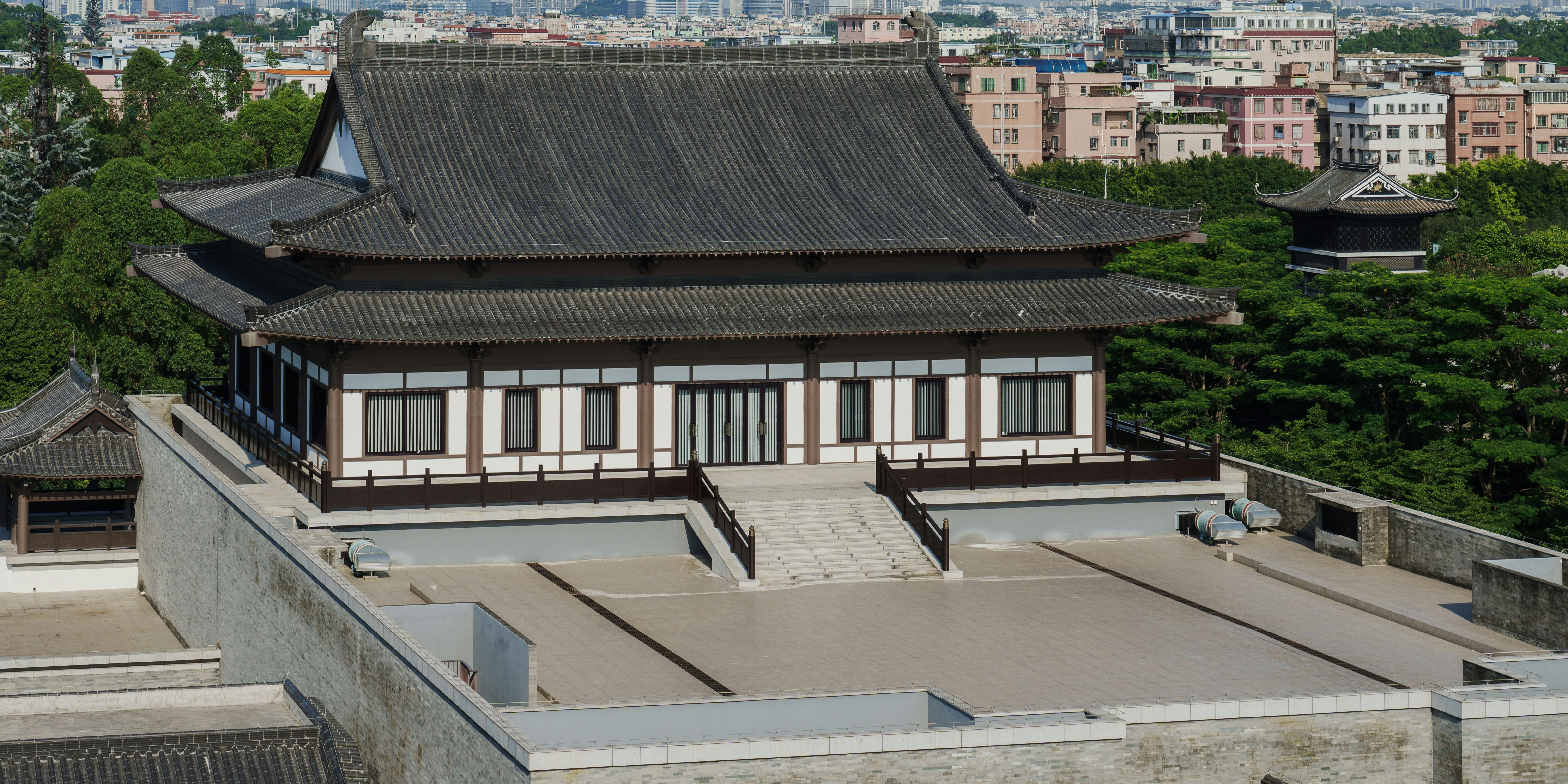 a tall building with a roof and windows