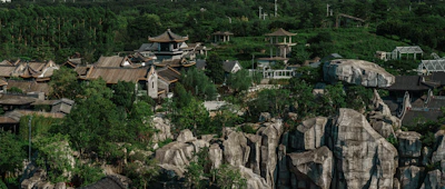 A scenic Vietnamese heritage site with traditional architecture and lush greenery.