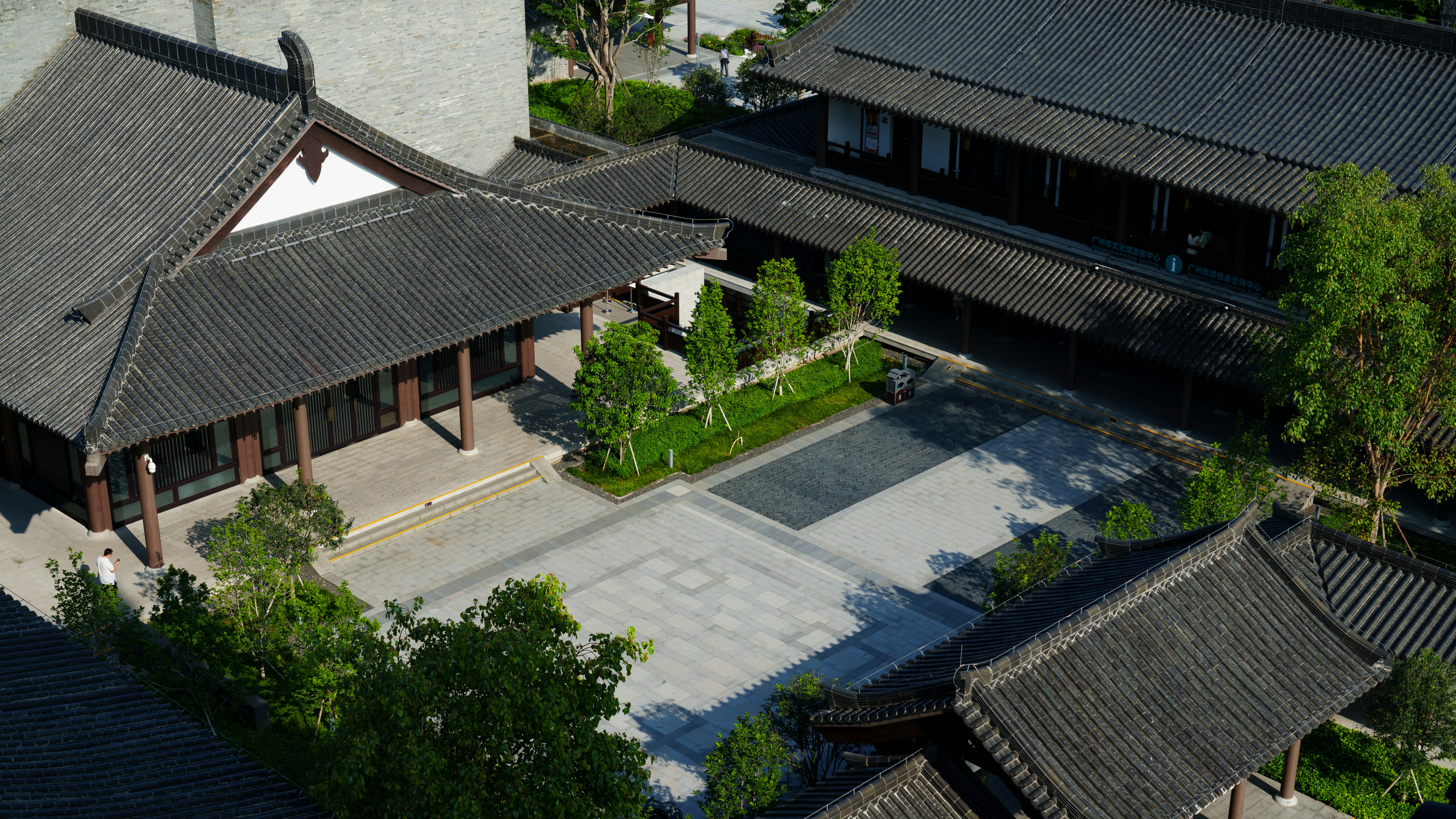 an aerial view of a building with a courtyard