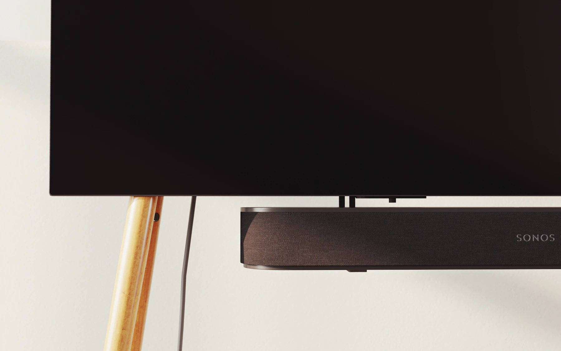 A large modern TV on a living room wall