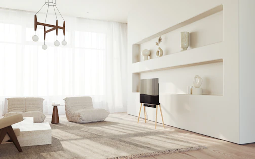 Bright and airy living room with minimalist luxury design and organized shelves.