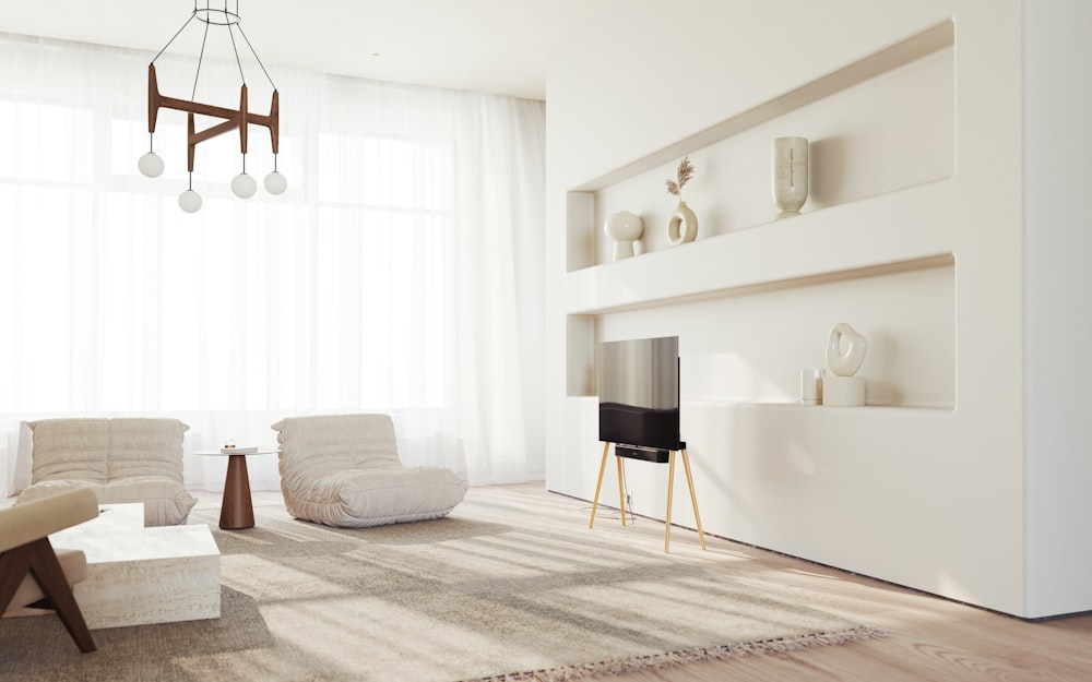 a living room with a white couch and a tv