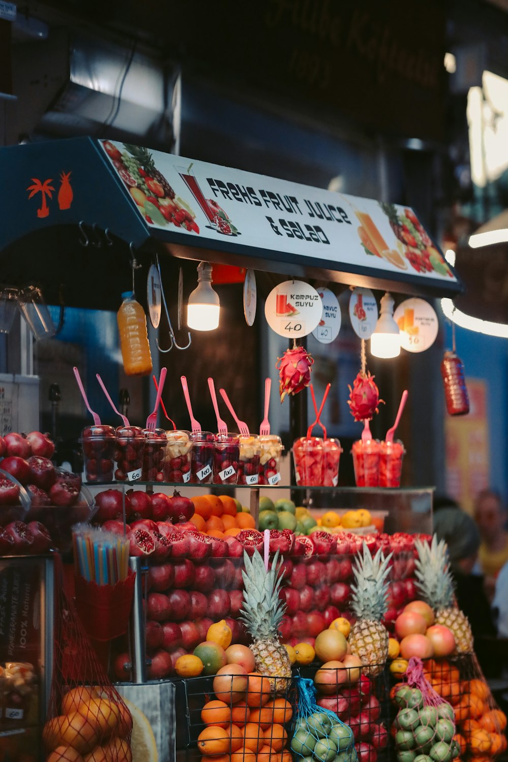 a fruit stand with many different types of fruit