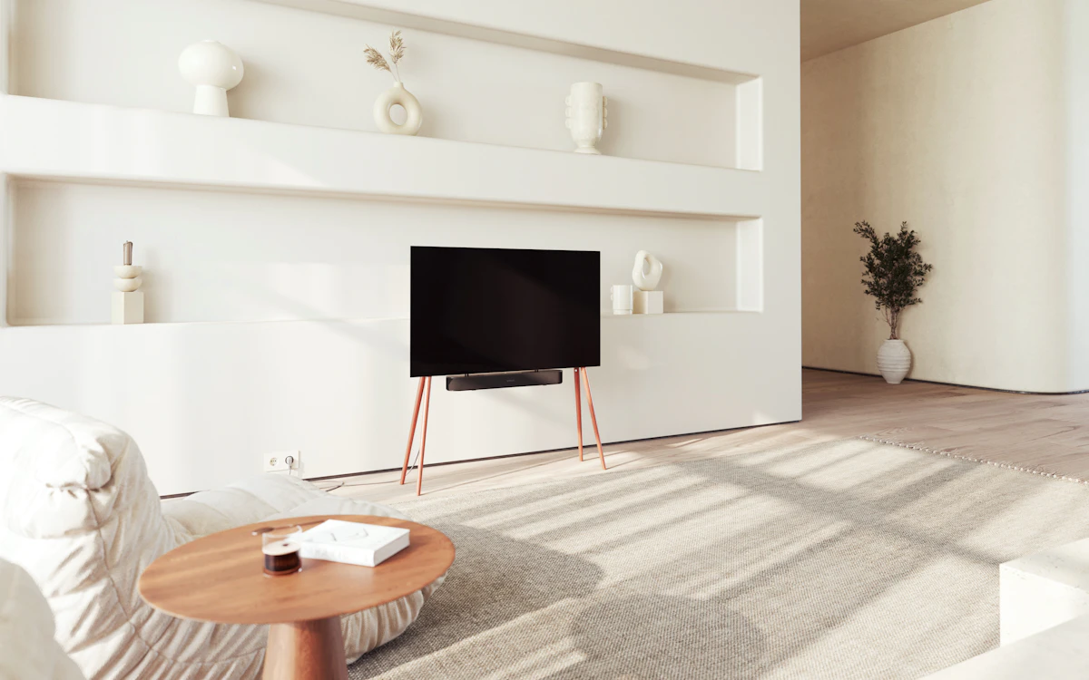 A living room with a large flat-screen TV on a wooden stand