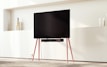 A modern TV wall with integrated LED lighting in a cozy setting.