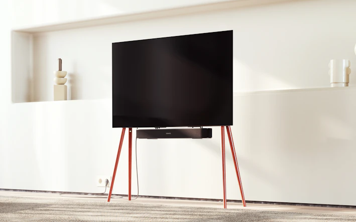 A sleek modern smart TV displaying vibrant colors in a cozy living room setting