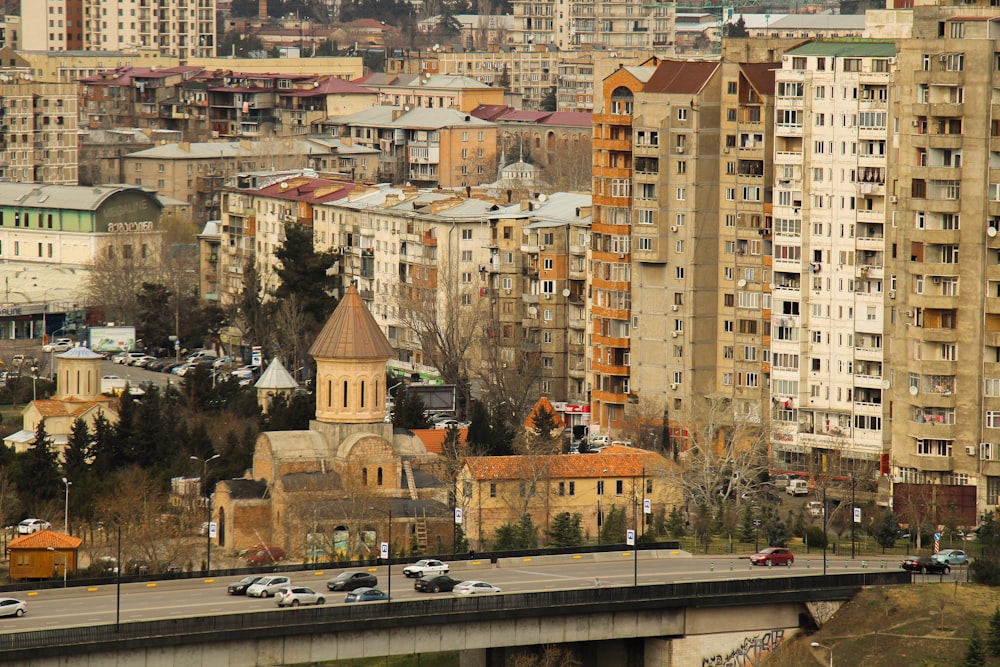 a view of a city with tall buildings and a bridge