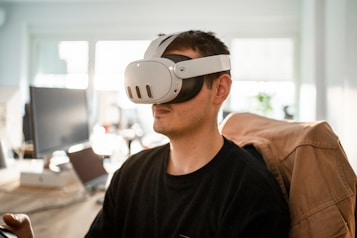 a man sitting in a chair wearing a pair of virtual glasses