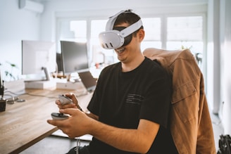 a man sitting at a desk wearing a Meta Quest 3