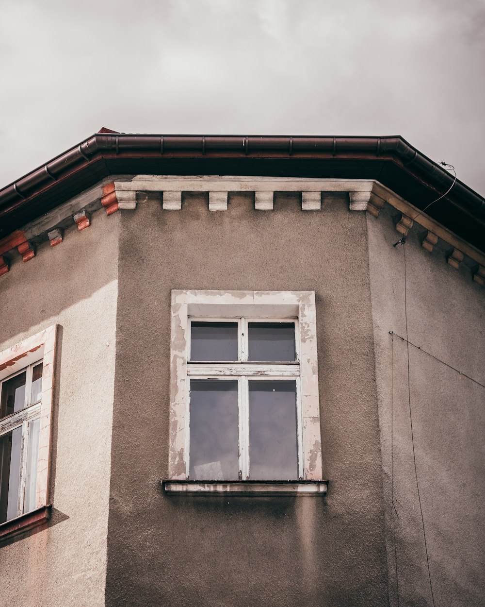 a window on a building with a sky background