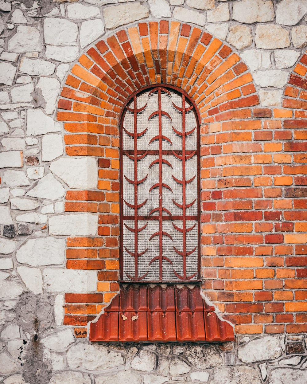 a brick wall with a window in it