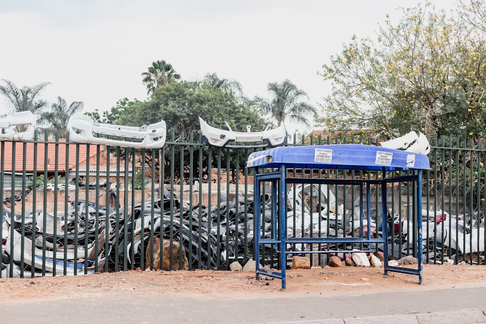 a bunch of bikes that are behind a fence