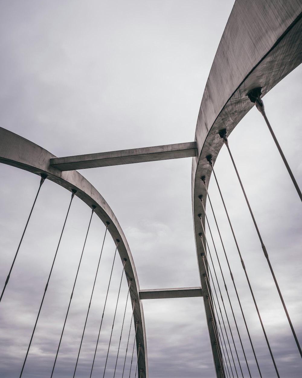 a view of a bridge from the ground