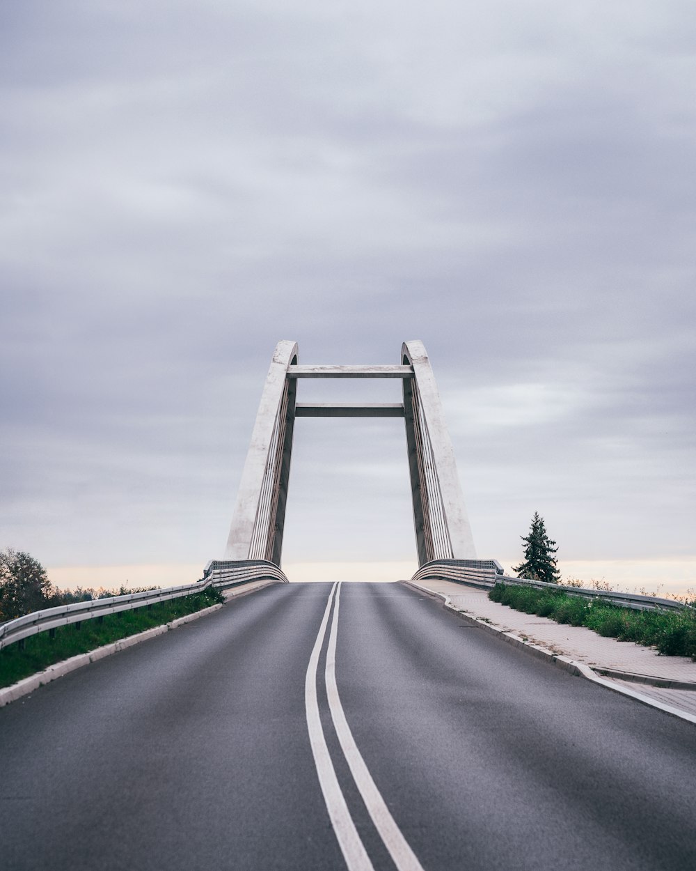 a road with a bridge in the middle of it