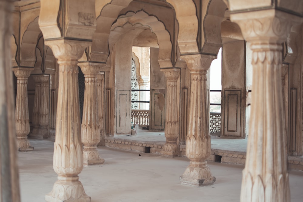 a large room with pillars and pillars in it