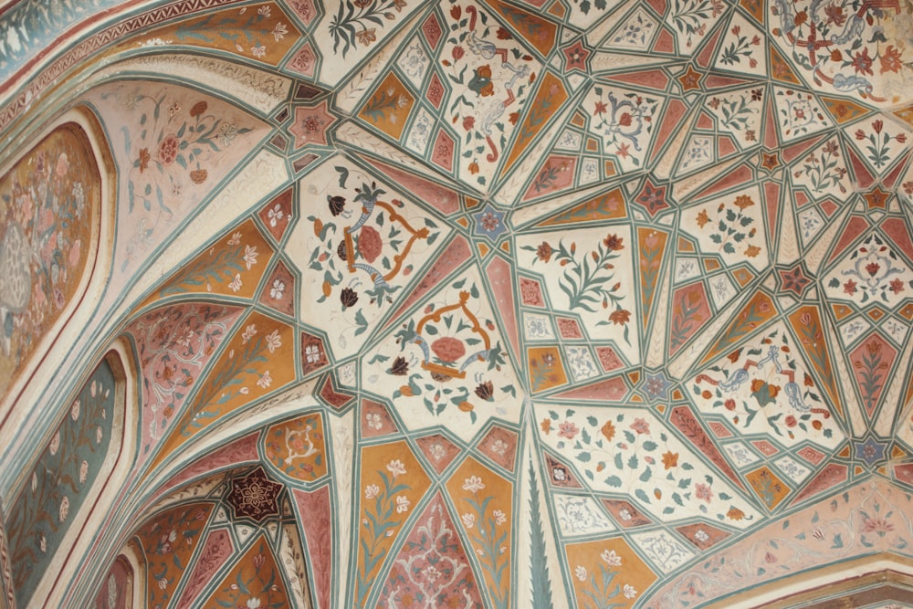 a close up of a building with a decorative ceiling